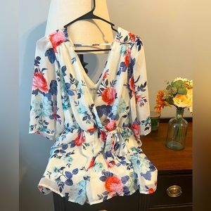 Floral romper with side bow tie